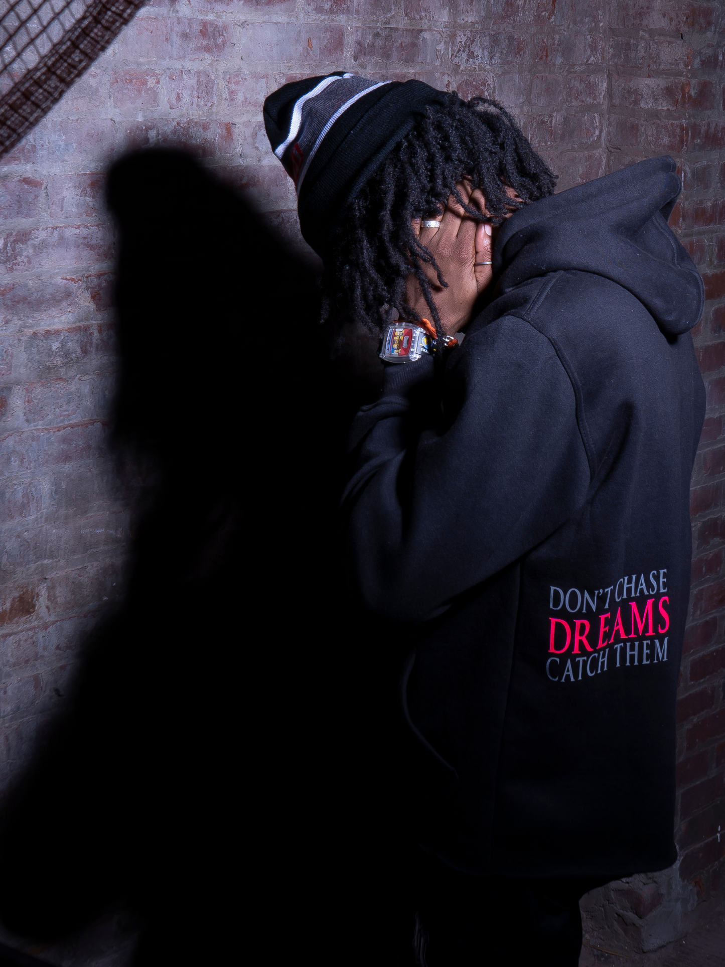 Model Wearing UBJ Beanie & Dreams Black Hoodie Back View