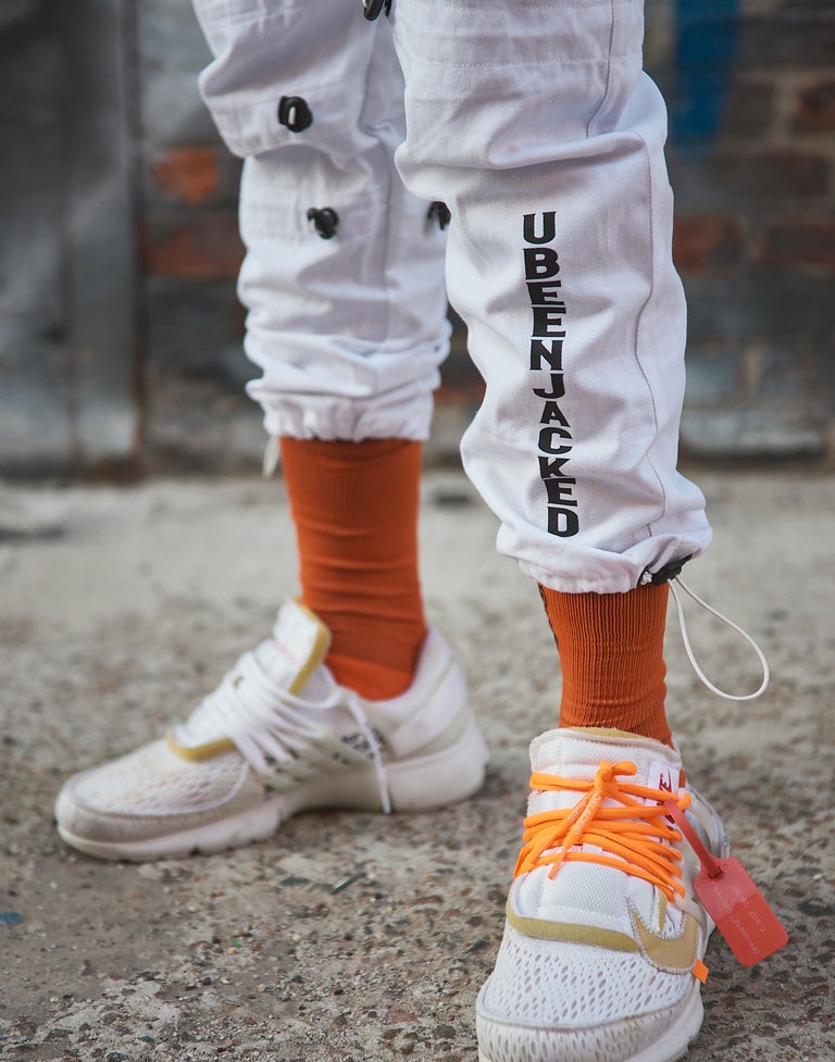 Close up UBEENJACKED Black Print on White Cargo Pants