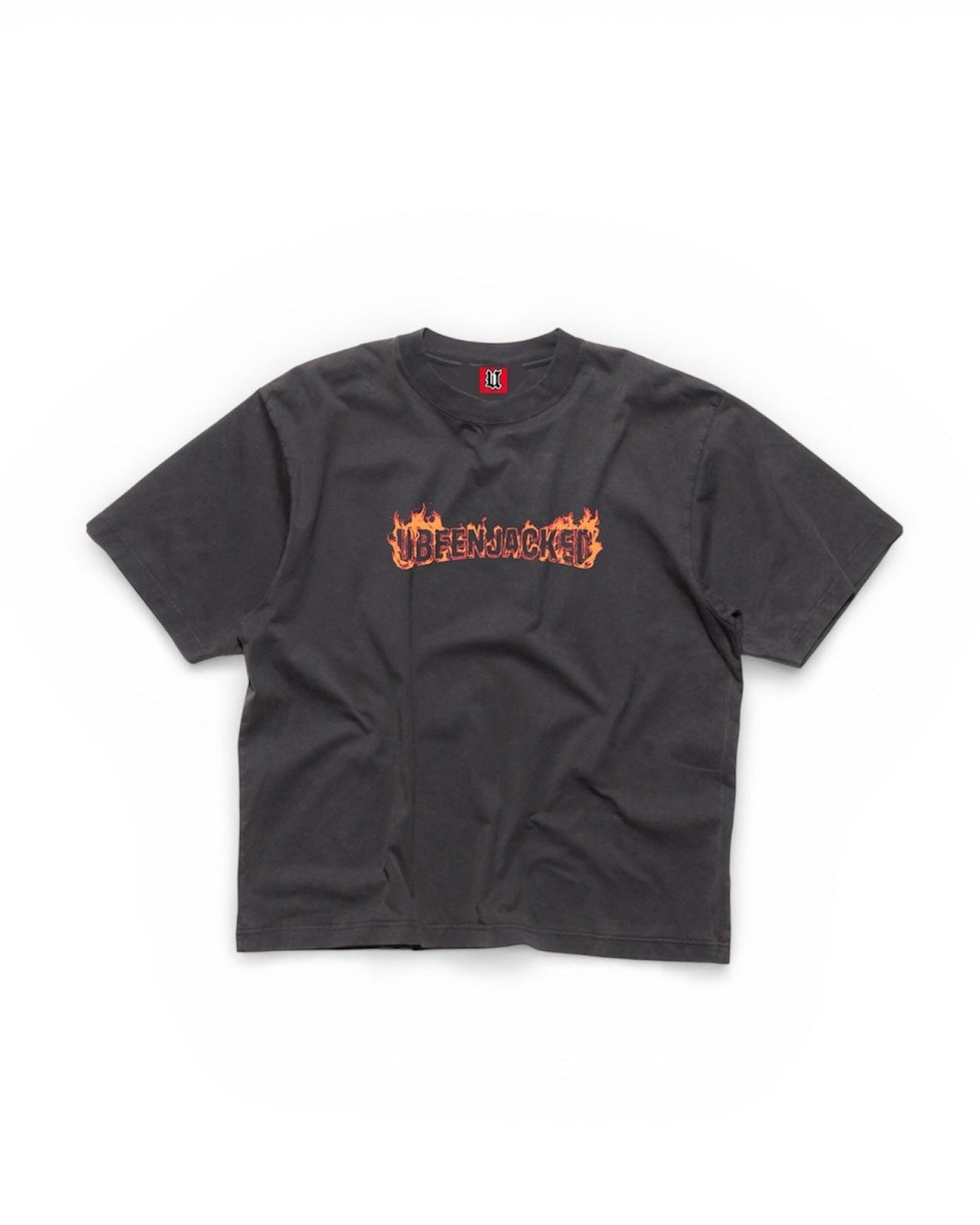 Black t-shirt with orange text on a white background