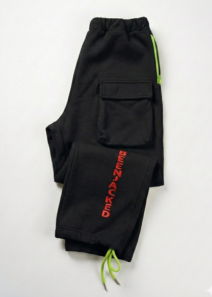 Black pants with red text and green drawstrings on a white background