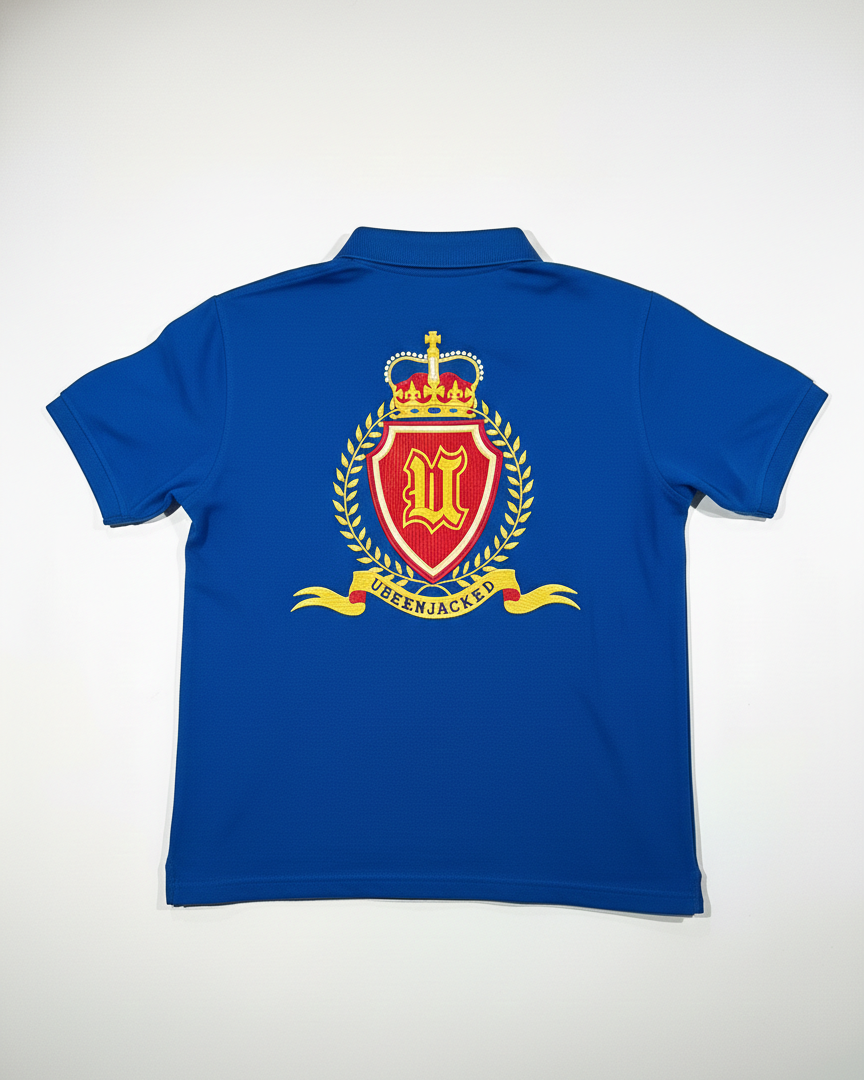 Blue polo shirt with a prominent emblem on the back against a white background