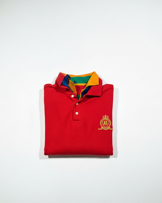 Folded red polo shirt with a logo on a white background