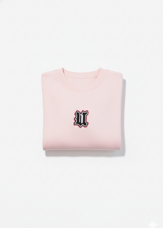 Pink sweatshirt with a logo on a white background