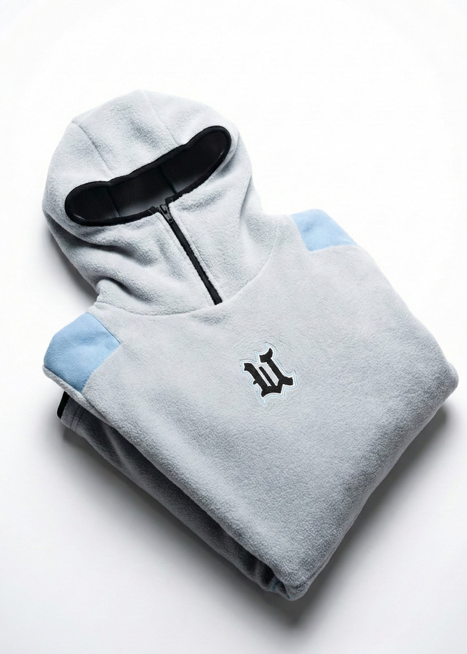 Folded gray hoodie with a logo on a white background