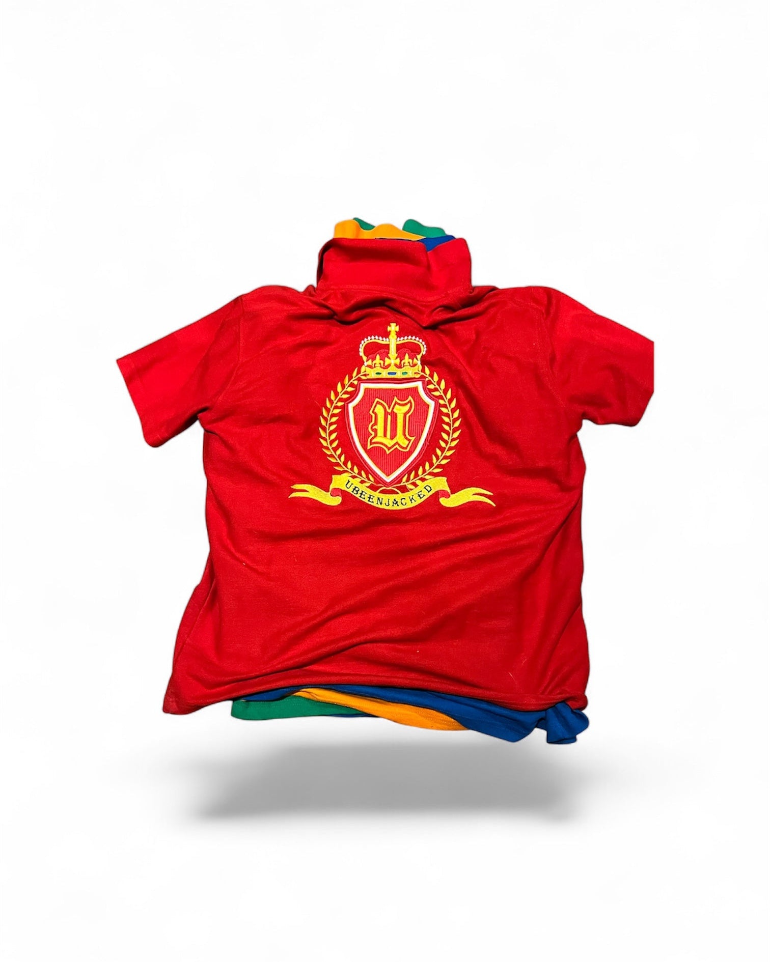 polo shirt with a colorful emblem on a white background