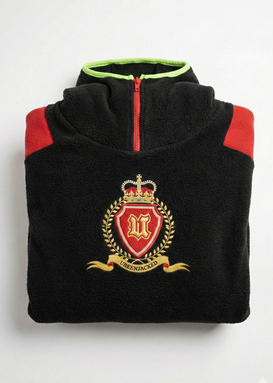 Black fleece with red shoulders and embroidered crest on a white background