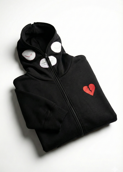 Black hoodie with a red heart design on a white background