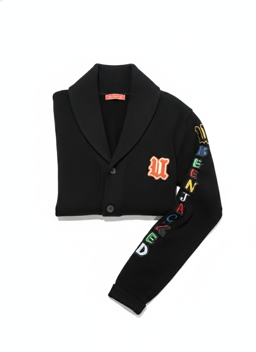 Black varsity jacket with colorful lettering on a white background