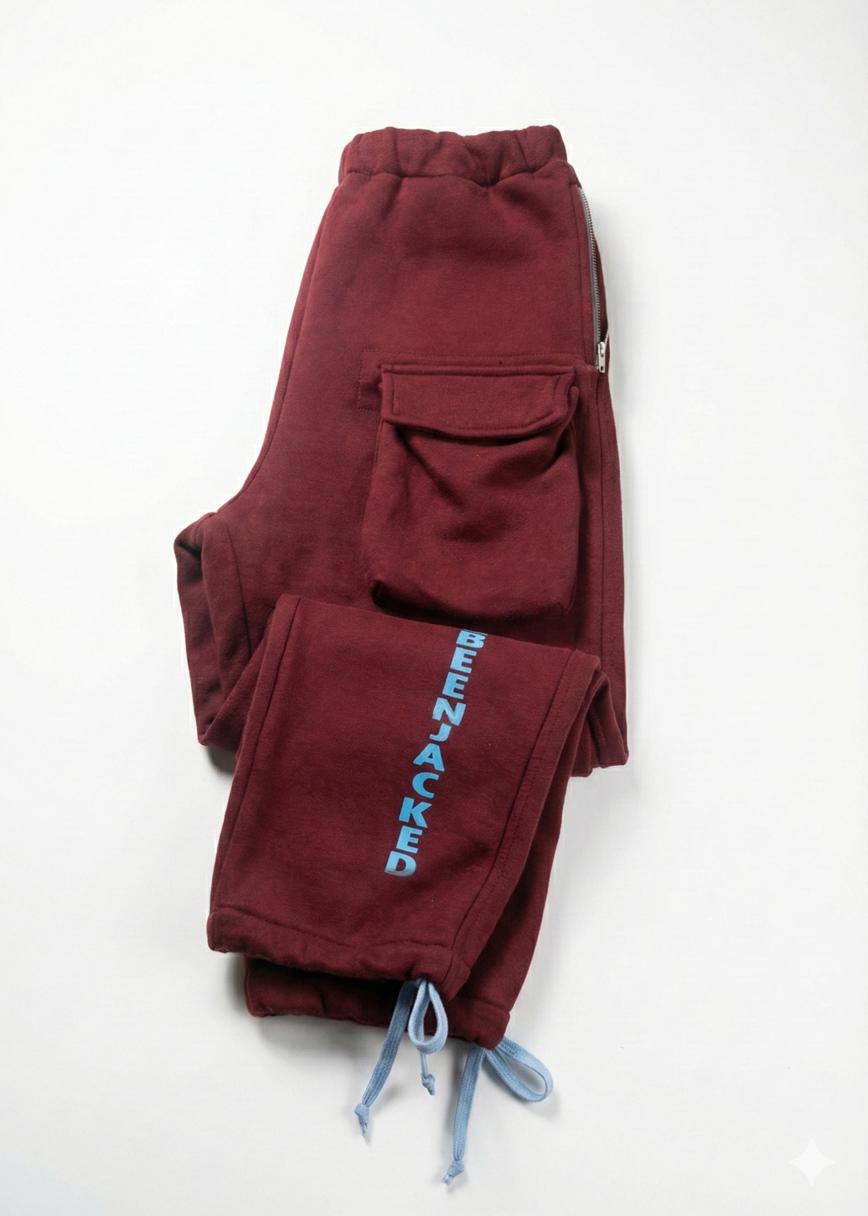Maroon cargo pants with 'BEENACKED' branding on a white background