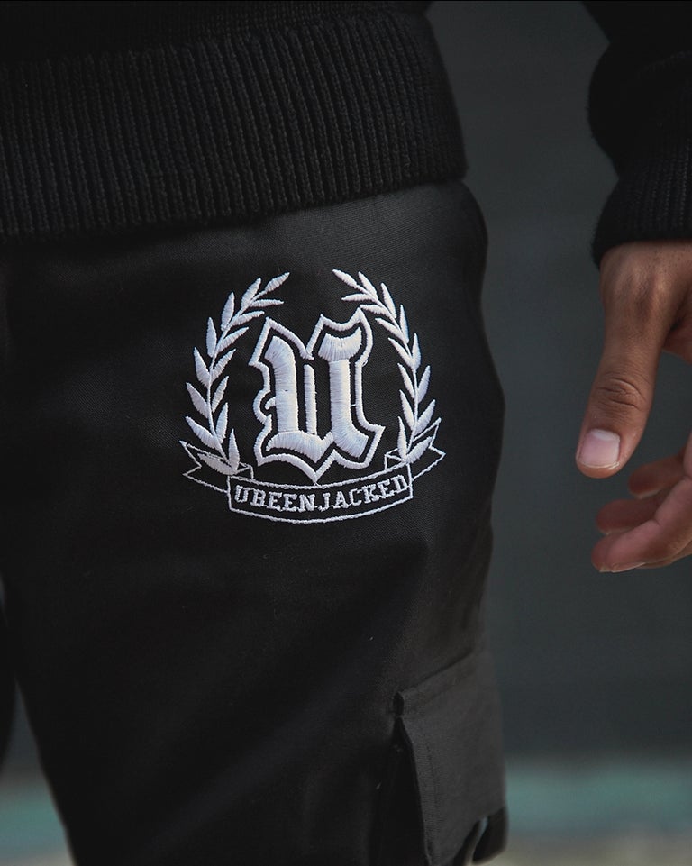 Close up UBJ logo embroidered black cargo pants