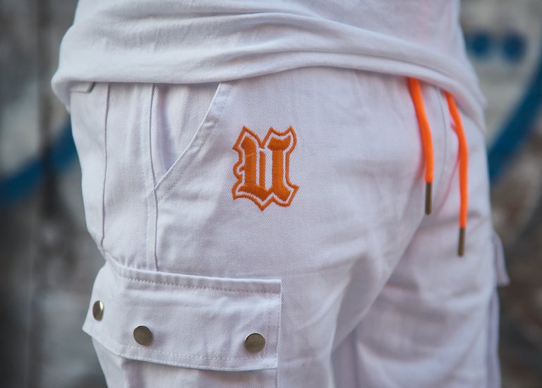 Close up UBJ logo embroidered white cargo pants